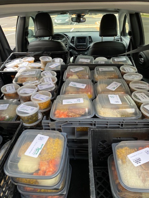 Car loaded up with grab-and-go boxes from the repack program