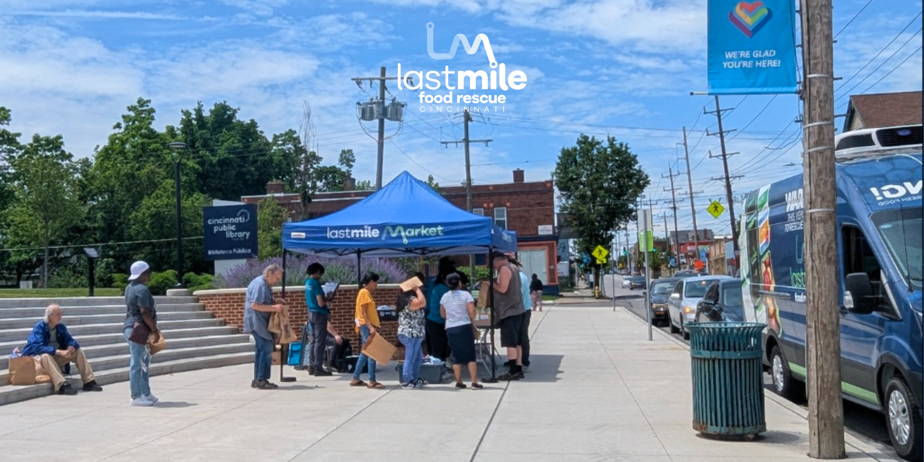 Last Mile Market at Price Hill Library – Mobile Market Distribution Community members gather at the Last Mile Market in front of the Price Hill Library to access free, fresh food from a mobile market van.